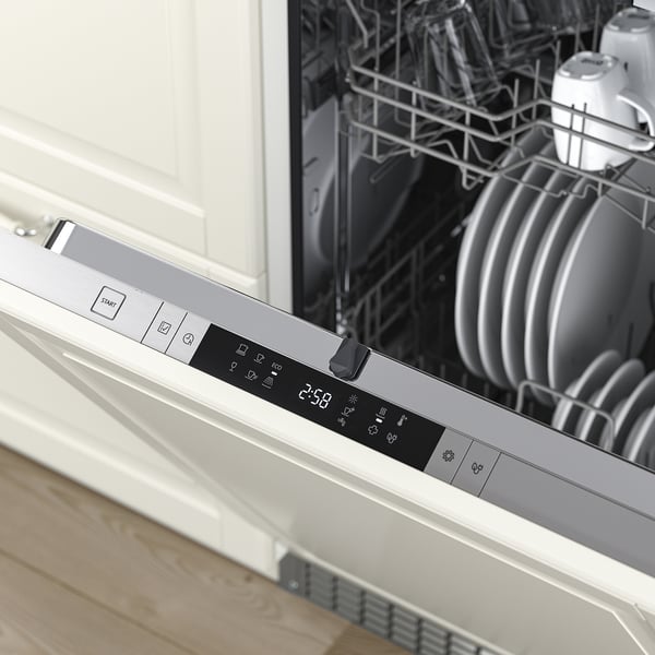 Open dishwasher with control panel displaying digital timer; stacked clean dishes.