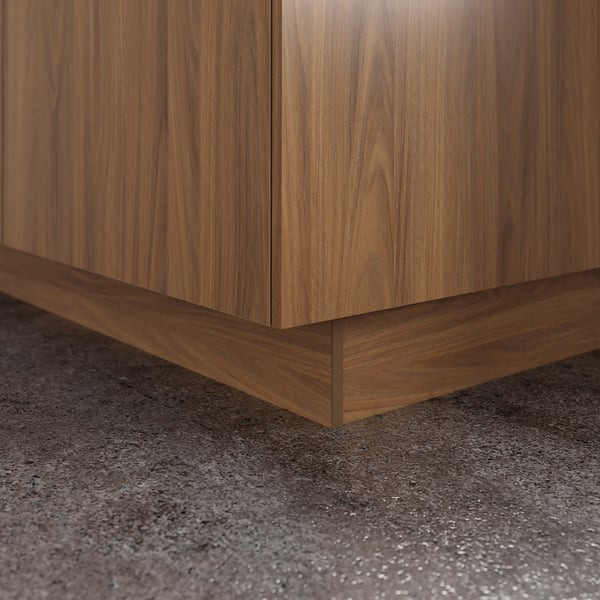 Wooden kitchen cabinet base in walnut finish. It covers the floor gap for a neat look.