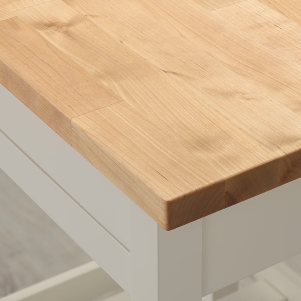 Wooden kitchen island corner, light, smooth.