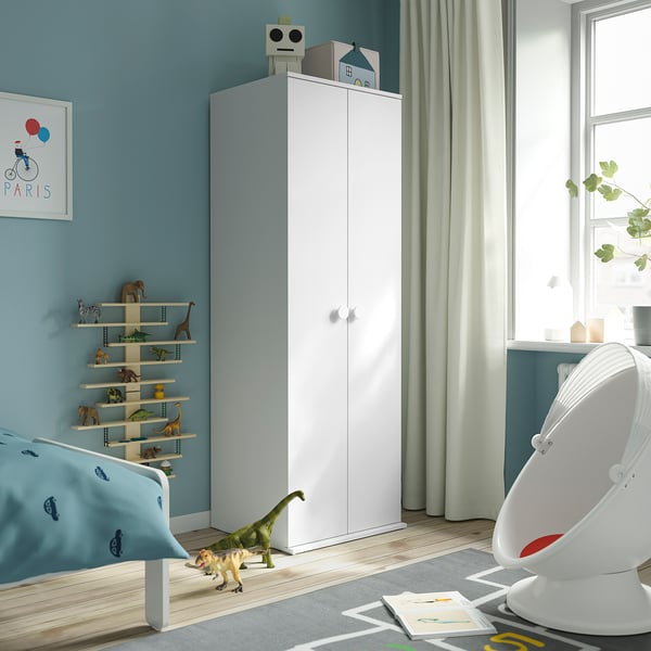 Kids room with tall white GODISHUS wardrobe, storing clothes and toys.