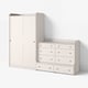 A white HAUGA furniture set with a wardrobe and chest of drawers, characterised by clean lines and minimalist design.