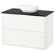 White HAVBÄCK bathroom cabinet with black countertop and round sink.
