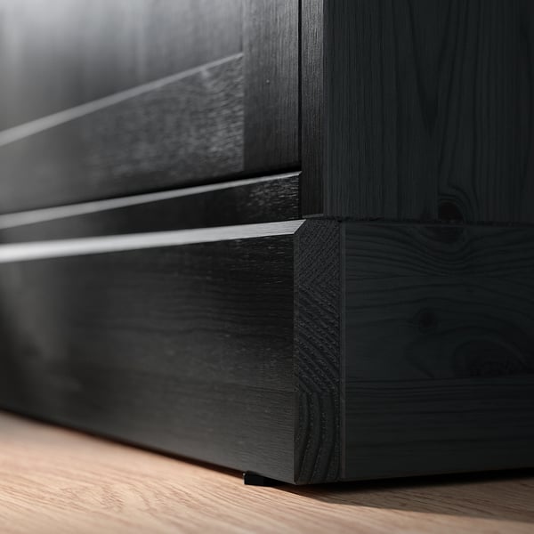 Black wood furniture close-up, HAVSTA series.