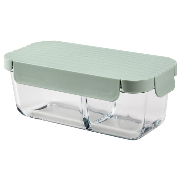 A rectangular glass lunch box with a light green snap-on lid, divided into two compartments.