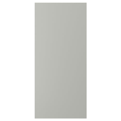 A light grey rectangular HAVSTORP kitchen cabinet door. The smooth, flat panel is made from acrylic paint and fibreboard.