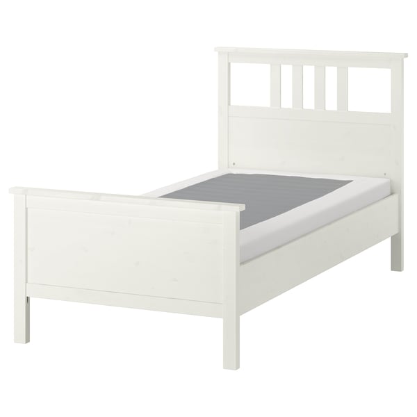 White HEMNES solid pine bed with high headboard and adjustable sides.