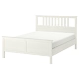 HEMNES white wooden bed, featuring slatted headboard and adjustable sides.