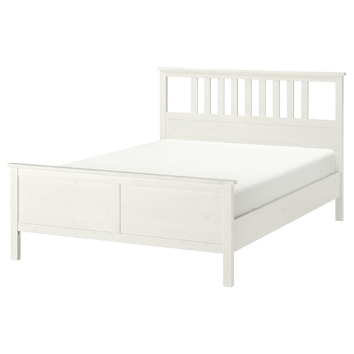 HEMNES white wooden bed, featuring slatted headboard and adjustable sides.