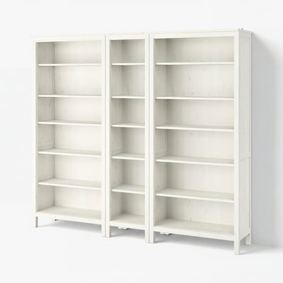 Two white wooden HEMNES bookcases, each with six adjustable shelves for versatile storage, featuring a traditional design.
