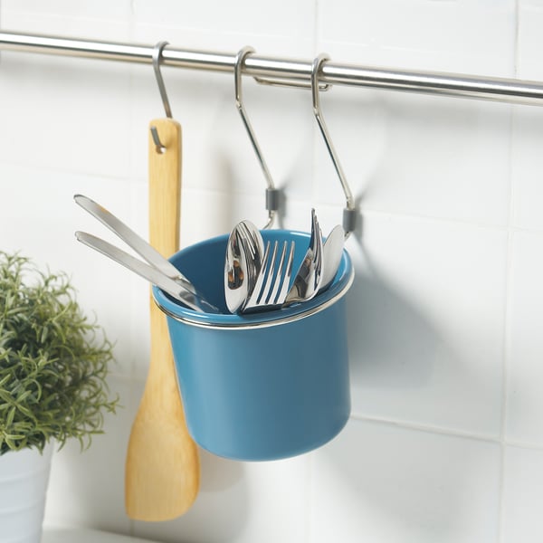 Blue HULTARP utensil holder hangs on rail, storing wooden and metal kitchen tools, efficiently organising workspace.