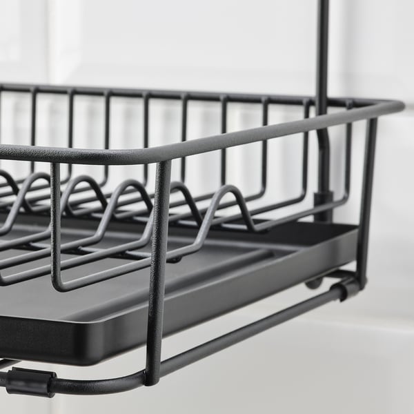 Black dish drainer with removable tray. Steel construction, powder coated for durability. Perfect for kitchen counter.