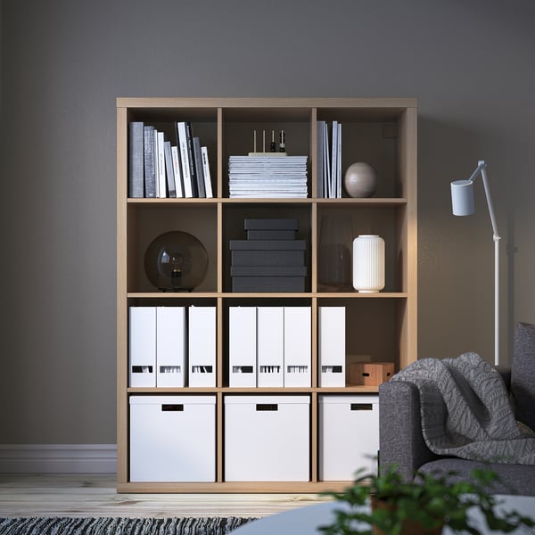 KALLAX shelving unit with books, decor, and storage.