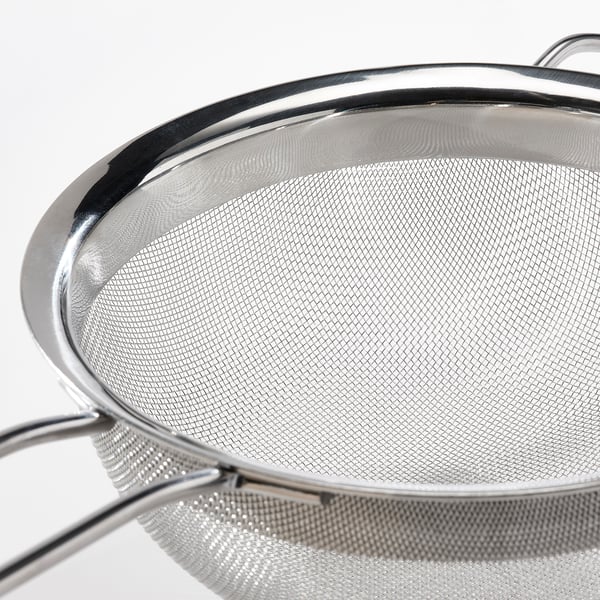 Stainless steel colander, fine mesh net, robust handles.