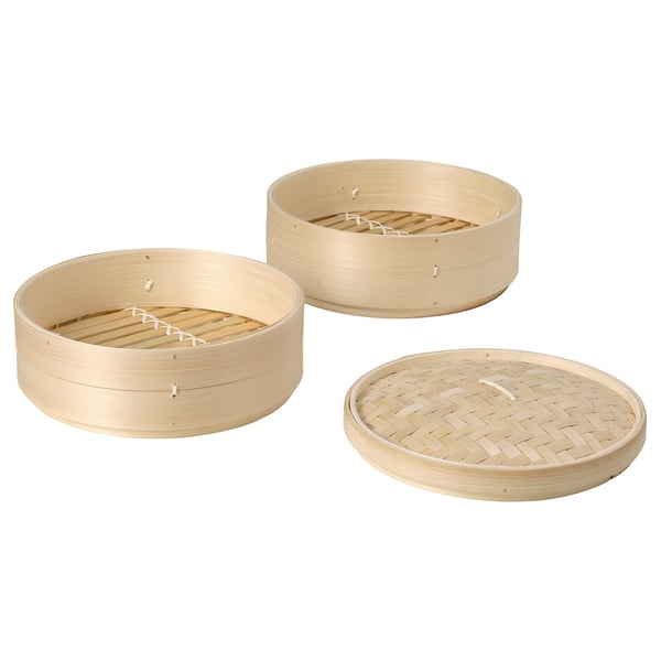 Three stacked bamboo steamers, round and natural in colour, showcasing traditional weaved design. Ideal for cooking and serving various foods.