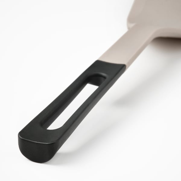 Close-up of a modern, ergonomic spatula handle with sleek design and comfortable grip, showcasing its high-quality construction.