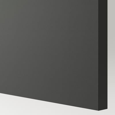The corner of a sleek, dark grey KNOXHULT kitchen cabinet. It smooth, scratch-resistant surfaces with clean, modern edges.