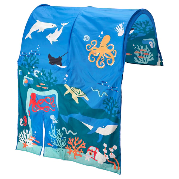 The KURA tent, blue with ocean theme, attaches to a bed, featuring fish, coral, and an octopus. Made from recycled polyester.
