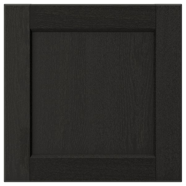 A black LERHYTTAN drawer front with a wooden frame and bevelled edges, featuring an inset veneer panel.