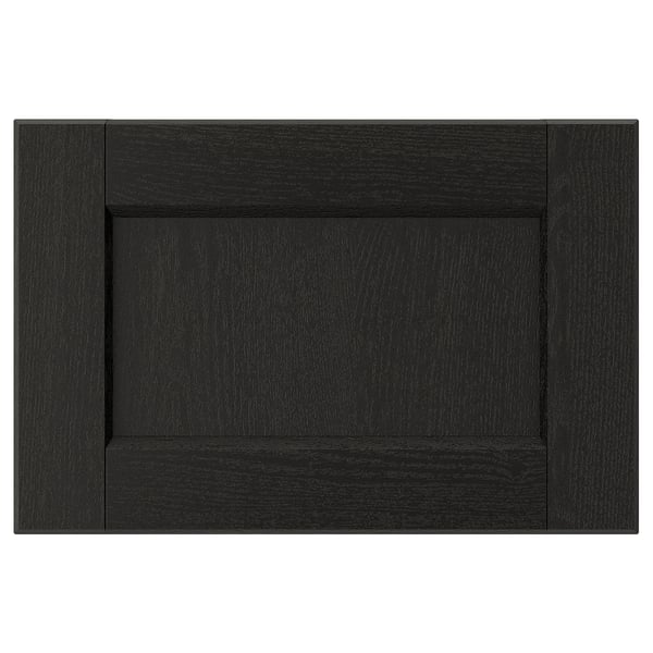Black wooden cabinet door with dark wood grain texture, rectangular shape, and simple bevelled edges.