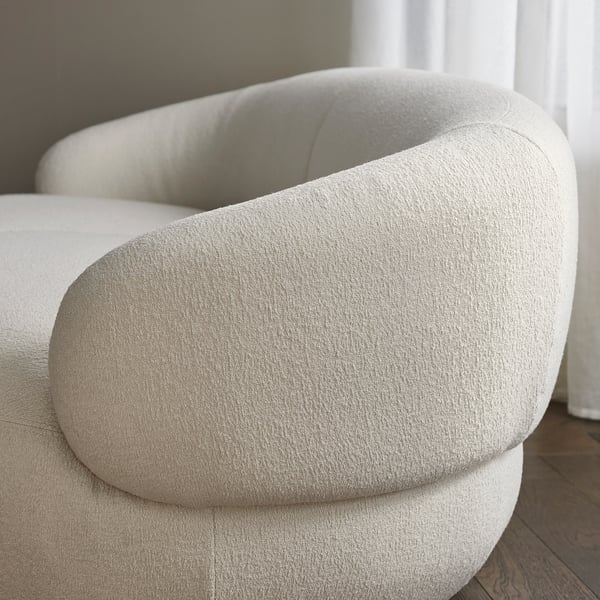 Comfortable LILLESÄTER chair with plush, rounded upholstery in light fabric. Its high-quality design and inviting, cosy appearance.