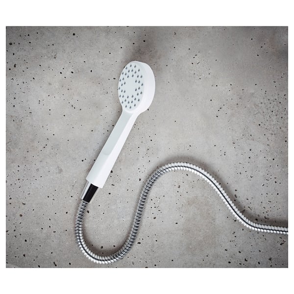 Displays a white LILLREVET handheld shower with a flexible hose on a speckled grey surface.
