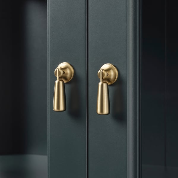 Dark wooden double doors with sleek, gold-colored handles, reflecting quality and modern design.