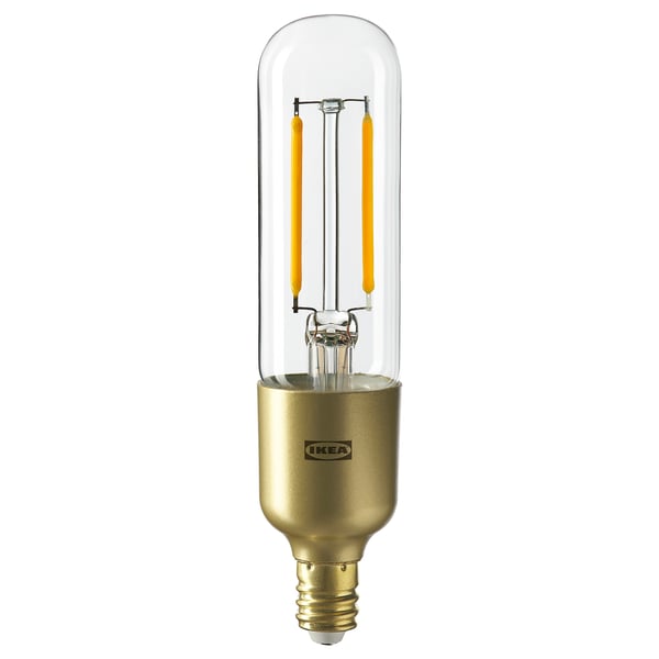 Ikea LUNNOM led bulb, gold. Classic glass design with visible yellow filament and decorative base, energy-efficient warm light.