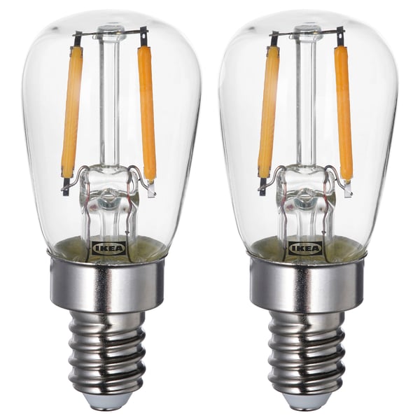 Two ikea LUNNOM led light bulbs, clear, retro style, energy-saving, warm white light.