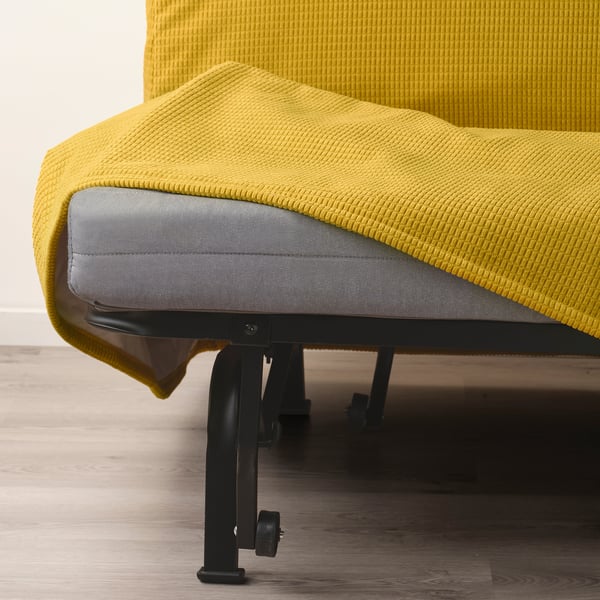 A bright yellow sofa with a grey mattress on a black metal frame.