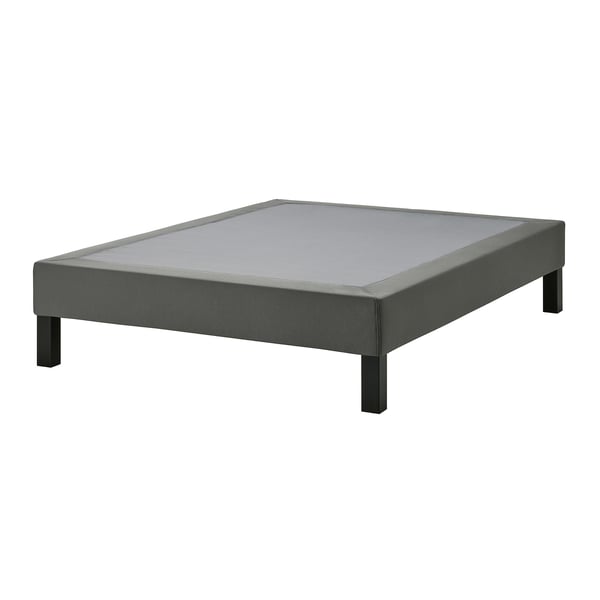 A grey LYNGÖR bed base with a flattened, rectangular design and removable cover. It uses recycled polyester and solid pine materials.
