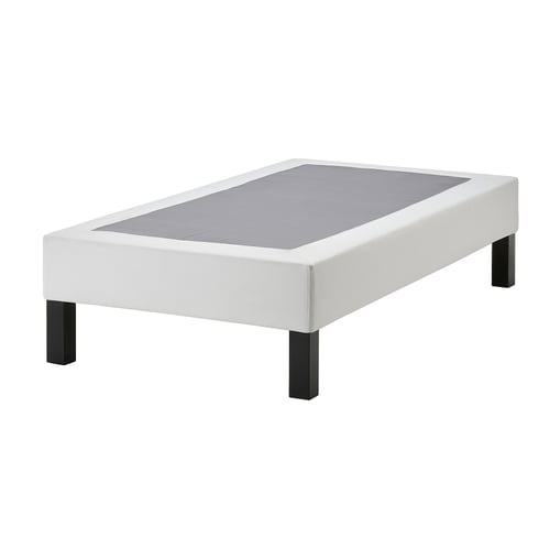 White LYNGÖR flat-pack bed base with wooden legs, rectangular, minimalist design.