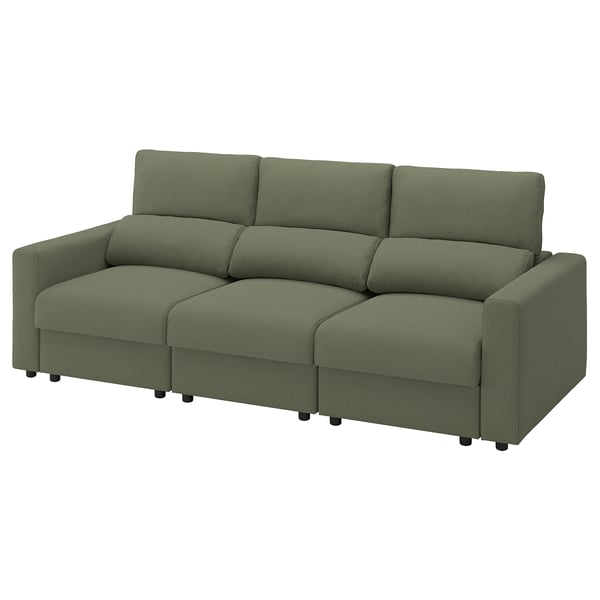 Modern green sofa with adjustable cushions for comfort. Simple, inviting design. Ideal for relaxation.
