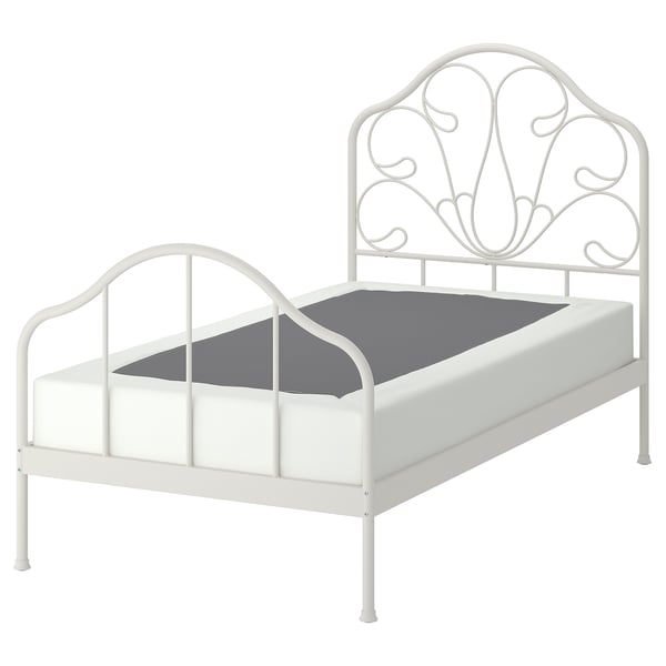 White MELLGRUND metal bed with wavy headboard and grey mattress.