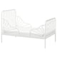A white, metal MINNEN extendable kids bed with a classic design. It vertical bars and a sturdy, supportive frame.