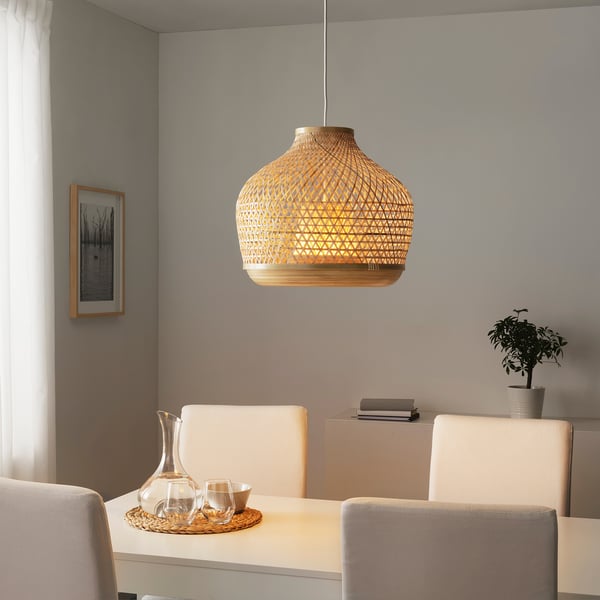 MISTERHULT bamboo pendant lamp over dining table, warm light.