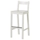 A white NORDVIKEN bar stool with a curved backrest and footrest, made of solid pine and veneer for comfort and durability.