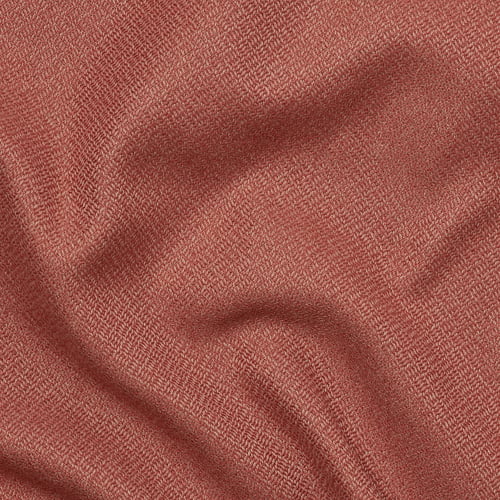 Close-up of textured, two-toned fabric, soft and inviting.