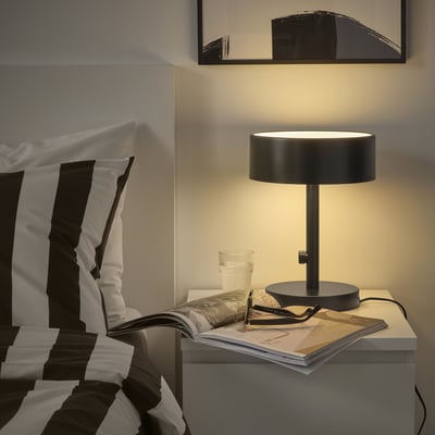 NYMÅNE lamp: sleek black metal & glass on bedside table, frosted shade.