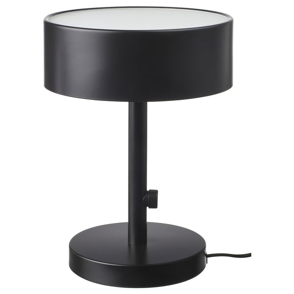 A black NYMÅNE table lamp with a round frosted glass shade and metal base.