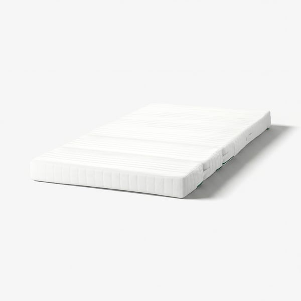 White ÖMSINT kids mattress, 3 sections, textured, supportive foam springs.