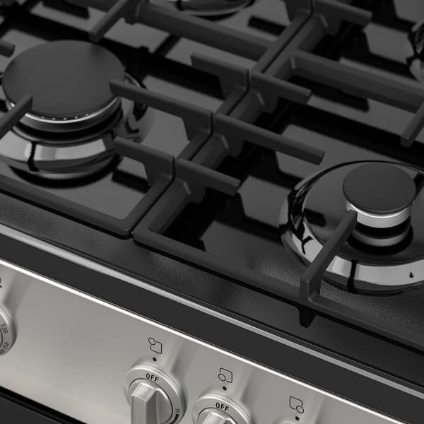 Gas stove with 4 burners, black knobs, control panel, and continuous grates.