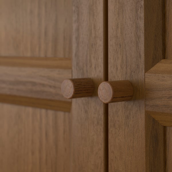 Wooden cabinet door with two cylindrical handles, aligned horizontally. Crafted with quality craftsmanship, featuring grooved handles for easy grip.