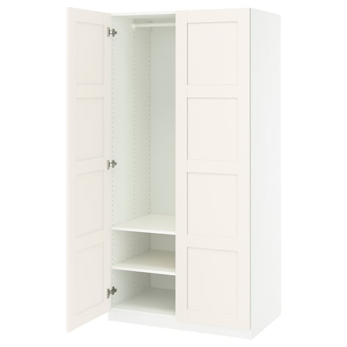 IKEA PAX wardrobe: white, tall, rectangular, two doors open, multiple shelves inside.