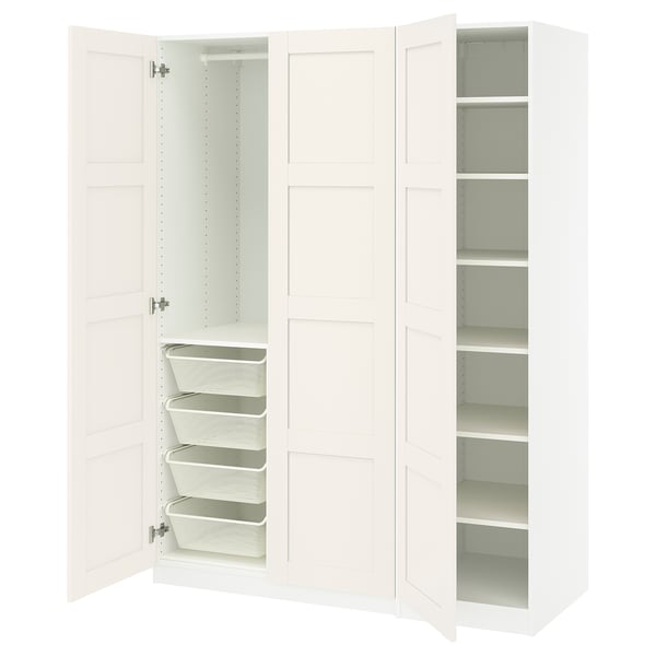White PAX closet unit, open showing shelves and mesh baskets. Modern, minimalist design for efficient storage.