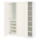 White PAX closet unit, open showing shelves and mesh baskets. Modern, minimalist design for efficient storage.