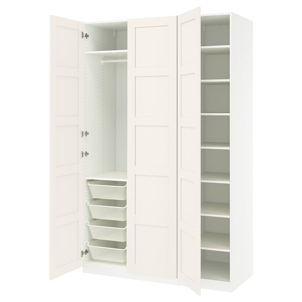 White PAX closet system: 3 doors, shelves, mesh baskets, metal/plywood.