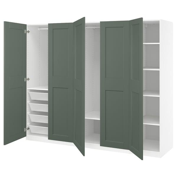 A green PAX wardrobe with shelves, drawers, and hanging space. Its a modern storage unit with a sleek design.