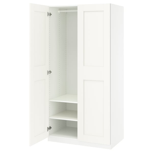 White PAX wardrobe: slim, tall, minimalist design. Soft-close doors, internal shelves.