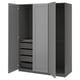 A grey PAX wardrobe with open doors, featuring drawers and shelves inside.