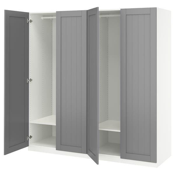 A grey PAX wardrobe with open doors, revealing shelves and a hanging rod inside. Its made of particleboard and fiberboard with a smooth, flat design.